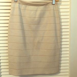 White and tan work skirt.